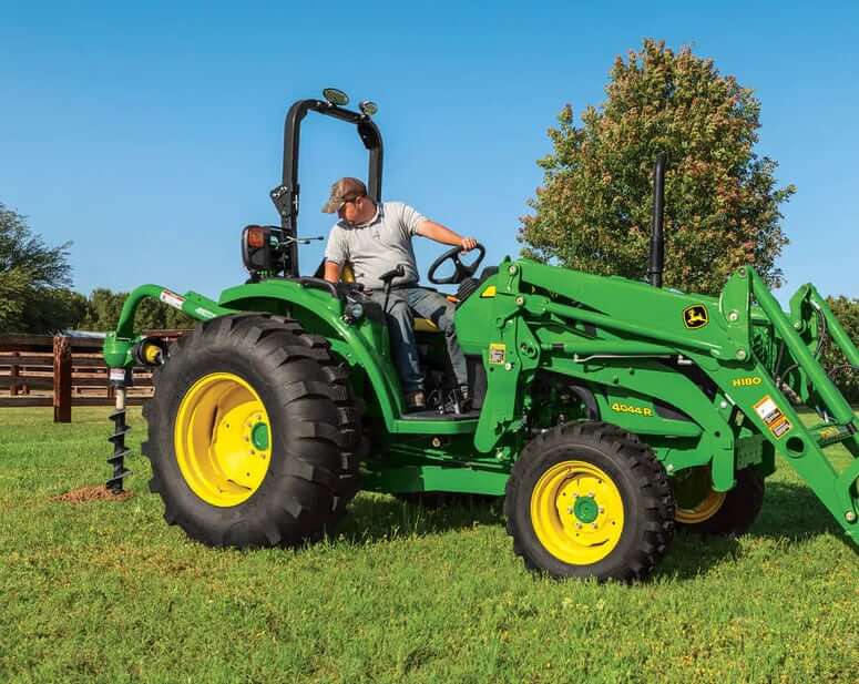 John Deere 4044R Tractor with Post Hole Digger Attachment