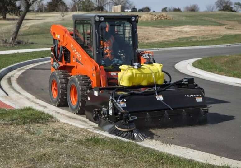 Kubota SSV75 with Hopper Broom Attachmnet