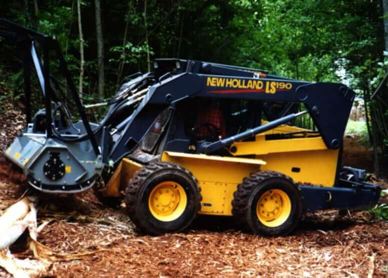New Holland LS190 with Forestry Mulcher Attachment